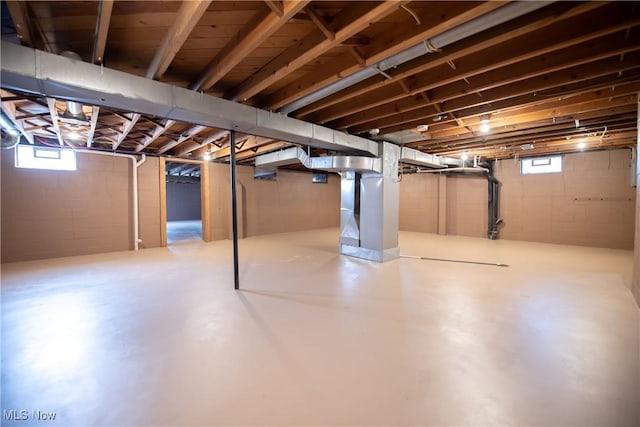 809 Mcdaniel Ave, Minerva, OH 44657 - below grade area with heating unit and plenty of natural light
