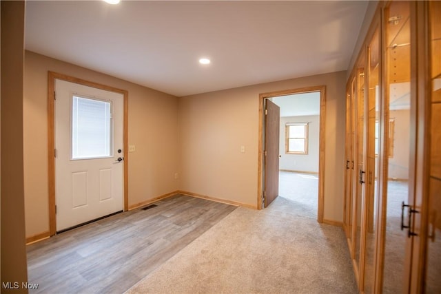 809 Mcdaniel Ave, Minerva, OH 44657 - unfurnished room featuring recessed lighting, light colored carpet, and light wood-type flooring