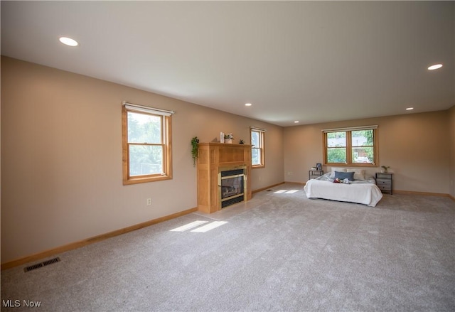 809 Mcdaniel Ave, Minerva, OH 44657 - living room featuring carpet floors, recessed lighting, and a glass covered fireplace