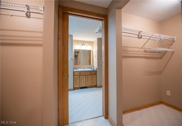 809 Mcdaniel Ave, Minerva, OH 44657 - spacious closet with light floors and a sink