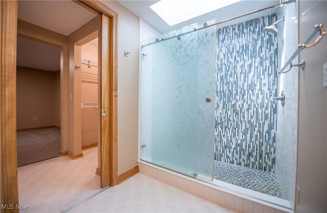 809 Mcdaniel Ave, Minerva, OH 44657 - bathroom featuring a shower stall, tile patterned floors, and a skylight