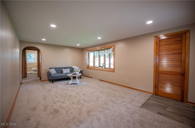 809 Mcdaniel Ave, Minerva, OH 44657 - carpeted living area featuring arched walkways and recessed lighting