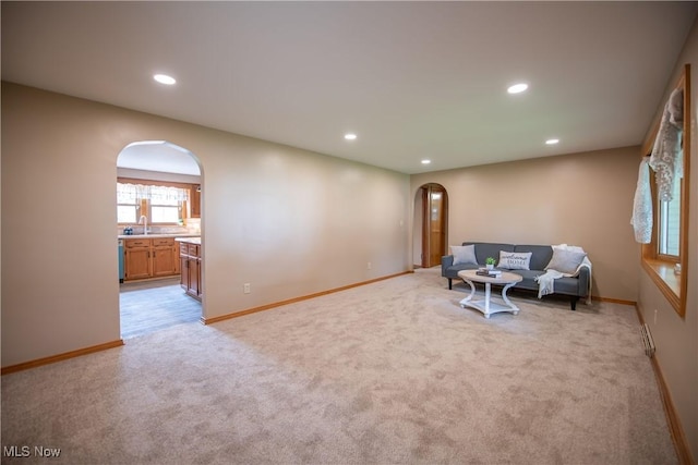 809 Mcdaniel Ave, Minerva, OH 44657 - unfurnished room featuring arched walkways, light carpet, and recessed lighting