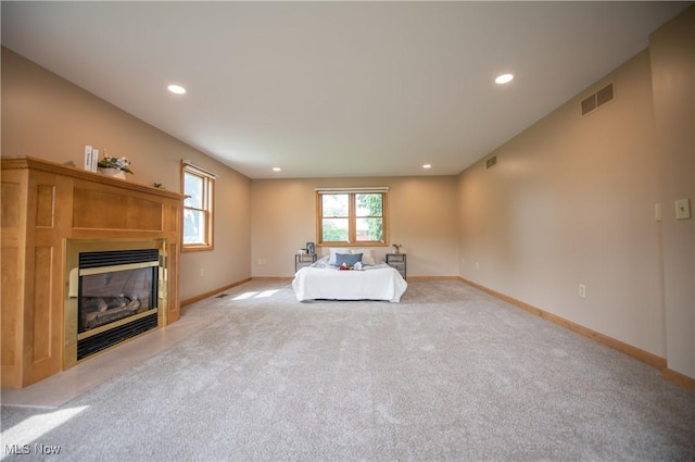 809 Mcdaniel Ave, Minerva, OH 44657 - living area with a glass covered fireplace, carpet, and recessed lighting