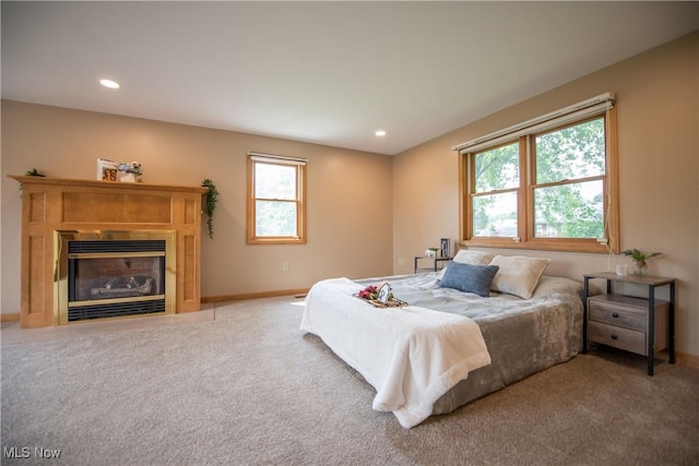 809 Mcdaniel Ave, Minerva, OH 44657 - carpeted bedroom with recessed lighting and a fireplace with flush hearth