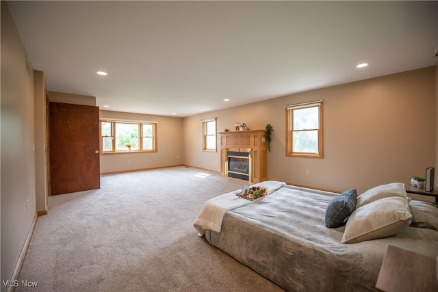 809 Mcdaniel Ave, Minerva, OH 44657 - bedroom featuring recessed lighting, light carpet, and a glass covered fireplace