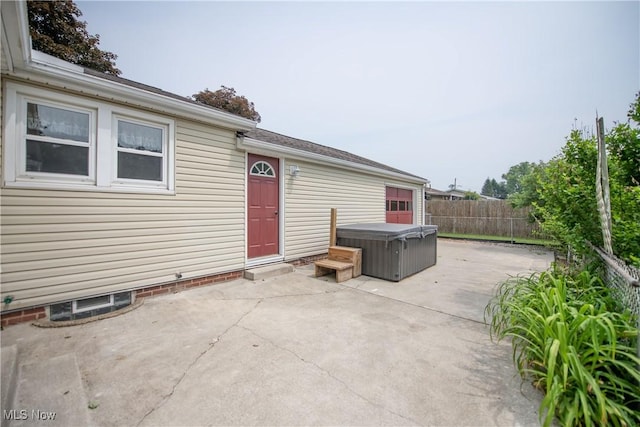 809 Mcdaniel Ave, Minerva, OH 44657 - fenced backyard with a hot tub and a patio area
