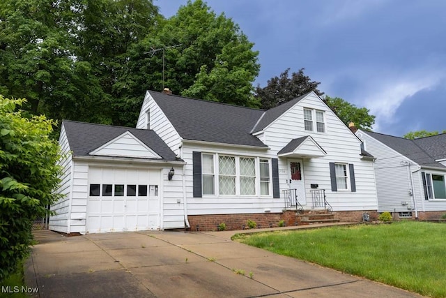 1114 W Miner Rd, Mayfield Heights, OH 44124 - view of front of home with an attached garage, a front yard, driveway, and a shingled roof