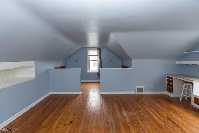 1114 W Miner Rd, Mayfield Heights, OH 44124 - additional living space with hardwood / wood-style flooring and lofted ceiling