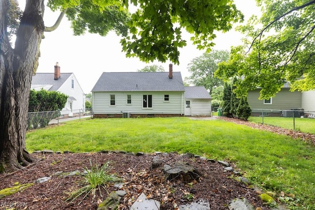 1114 W Miner Rd, Mayfield Heights, OH 44124 - rear view of property featuring a fenced backyard and a chimney