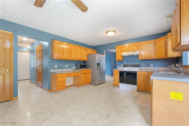 2919 Pepper Hill Cir, Akron, OH 44312 - kitchen with stainless steel appliances, under cabinet range hood, a ceiling fan, light countertops, and a textured ceiling