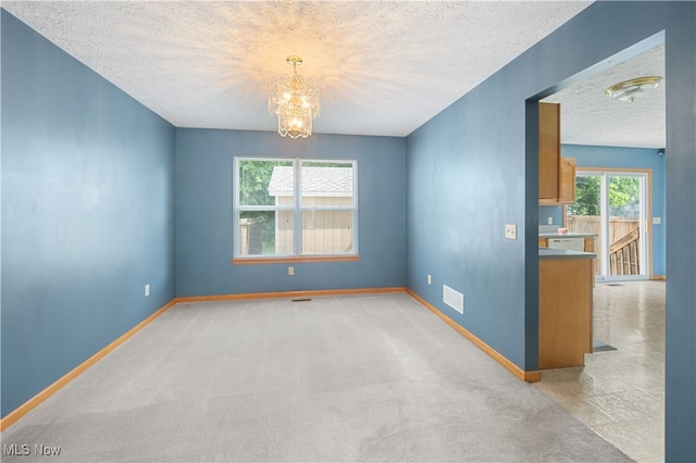 2919 Pepper Hill Cir, Akron, OH 44312 - unfurnished room featuring a textured ceiling and a chandelier