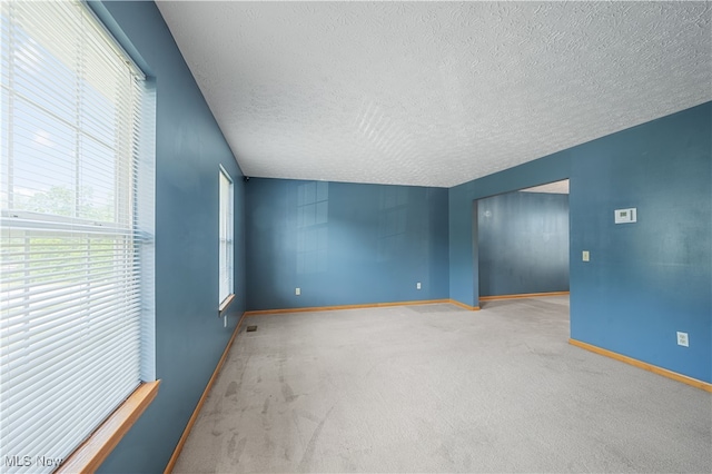 2919 Pepper Hill Cir, Akron, OH 44312 - empty room with a textured ceiling and carpet floors