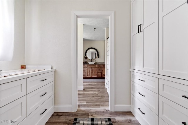 59301 Honeybee Rd, Senecaville, OH 43780 - bathroom featuring vanity, wood finished floors, and a textured ceiling