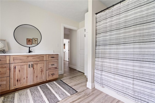 59301 Honeybee Rd, Senecaville, OH 43780 - bathroom with vanity, wood finished floors, and a shower with curtain