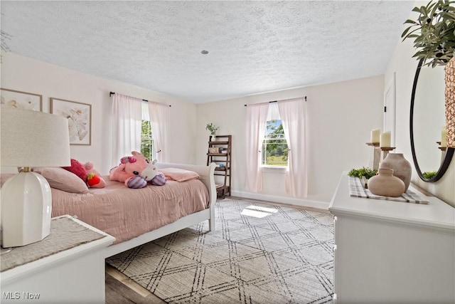59301 Honeybee Rd, Senecaville, OH 43780 - bedroom featuring a textured ceiling and baseboards