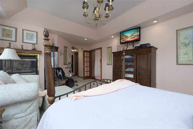 1015 Cambridge Ct NE, Warren, OH 44484 - carpeted bedroom with a chandelier, recessed lighting, and a raised ceiling