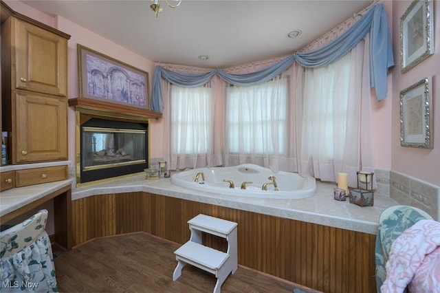 1015 Cambridge Ct NE, Warren, OH 44484 - bathroom with a tub with jets and wood finished floors