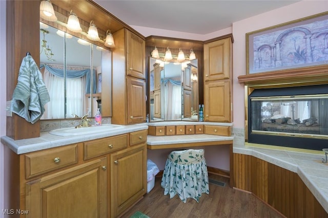 1015 Cambridge Ct NE, Warren, OH 44484 - bathroom with vanity and wood finished floors