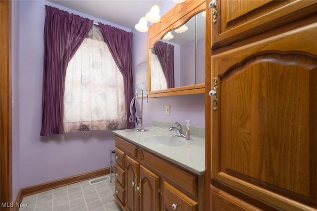 1015 Cambridge Ct NE, Warren, OH 44484 - bathroom featuring vanity and baseboards