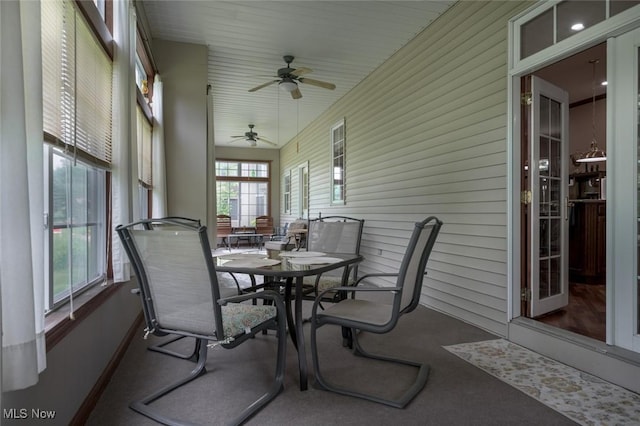 1015 Cambridge Ct NE, Warren, OH 44484 - sunroom with ceiling fan and outdoor dining area