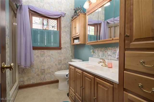 1015 Cambridge Ct NE, Warren, OH 44484 - full bath featuring wallpapered walls, vanity, tile patterned flooring, and an enclosed shower