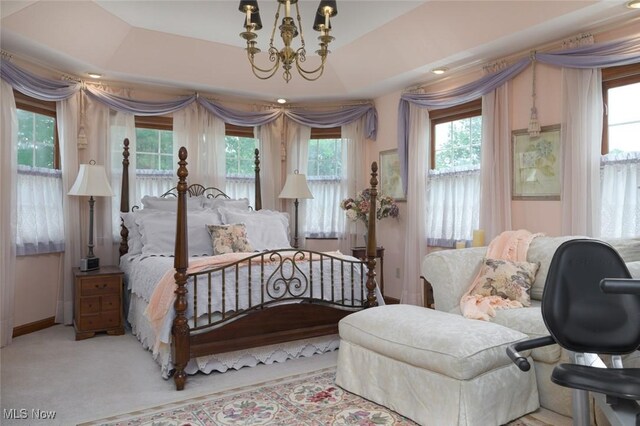 1015 Cambridge Ct NE, Warren, OH 44484 - bedroom with a chandelier, access to outside, and carpet flooring