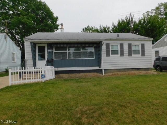 4139 W 144th St, Cleveland, OH 44135 - view of front of home with a front yard and a chimney