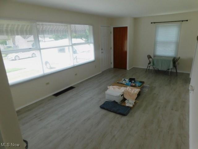 4139 W 144th St, Cleveland, OH 44135 - unfurnished living room with wood finished floors and baseboards
