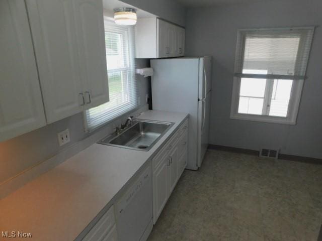 4139 W 144th St, Cleveland, OH 44135 - kitchen featuring white appliances, white cabinets, and light countertops