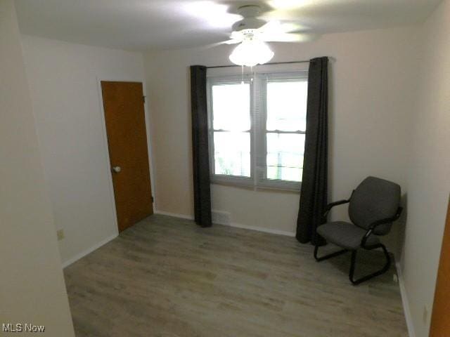 4139 W 144th St, Cleveland, OH 44135 - living area with light wood-style flooring and baseboards