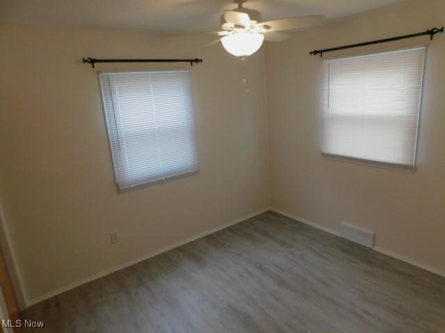 4139 W 144th St, Cleveland, OH 44135 - empty room with ceiling fan and wood finished floors