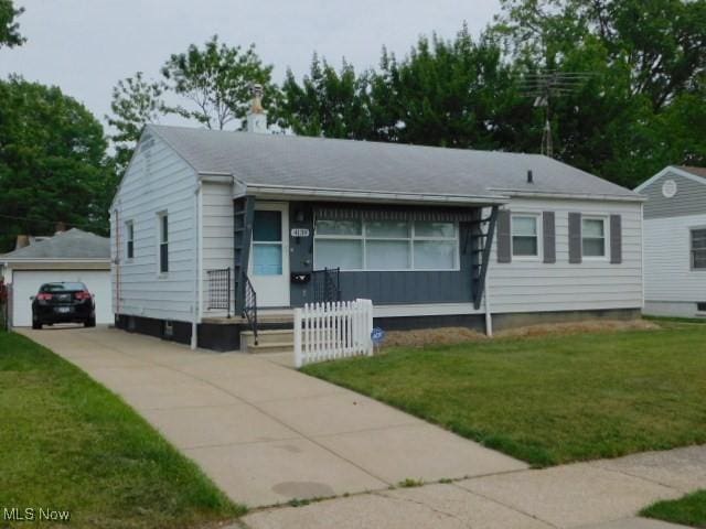 4139 W 144th St, Cleveland, OH 44135 - view of front of home with an outdoor structure, a front yard, and a detached garage