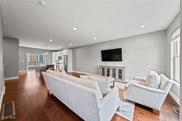 1335 W Clifton Blvd, Lakewood, OH 44107 - living room featuring recessed lighting and dark wood-style floors