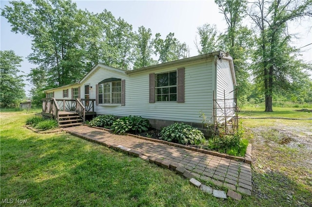 2500 Mcclintocksburg Rd, Deerfield, OH 44411 - view of front of house with a deck and a front lawn