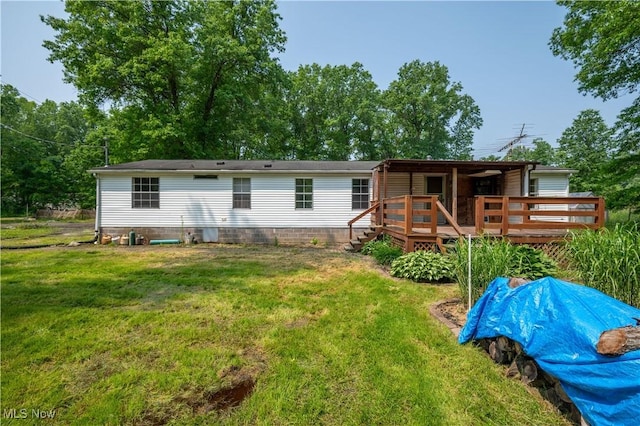 2500 Mcclintocksburg Rd, Deerfield, OH 44411 - rear view of property with a deck and a yard