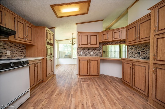 2500 Mcclintocksburg Rd, Deerfield, OH 44411 - kitchen featuring white range oven, brown cabinets, a textured ceiling, light wood finished floors, and decorative backsplash