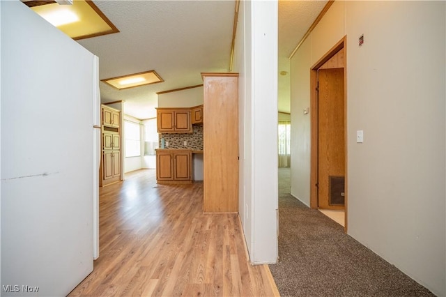 2500 Mcclintocksburg Rd, Deerfield, OH 44411 - hallway featuring healthy amount of natural light, light wood finished floors, and a textured ceiling