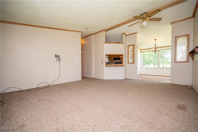 2500 Mcclintocksburg Rd, Deerfield, OH 44411 - unfurnished living room with crown molding, ceiling fan, carpet flooring, a chandelier, and vaulted ceiling
