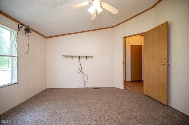 2500 Mcclintocksburg Rd, Deerfield, OH 44411 - carpeted empty room with crown molding, healthy amount of natural light, ceiling fan, and a textured ceiling