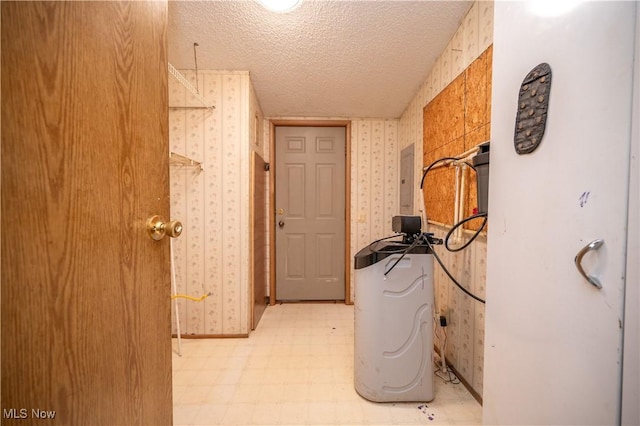 2500 Mcclintocksburg Rd, Deerfield, OH 44411 - corridor featuring wallpapered walls, light floors, a textured ceiling, and electric panel