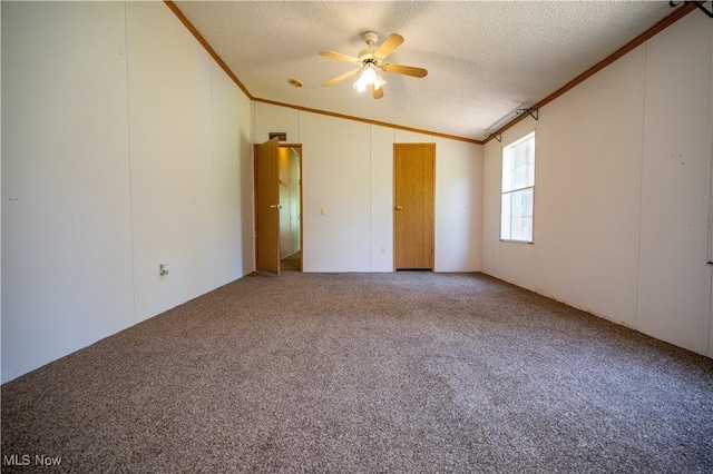 2500 Mcclintocksburg Rd, Deerfield, OH 44411 - carpeted spare room with ornamental molding, vaulted ceiling, a textured ceiling, and a ceiling fan