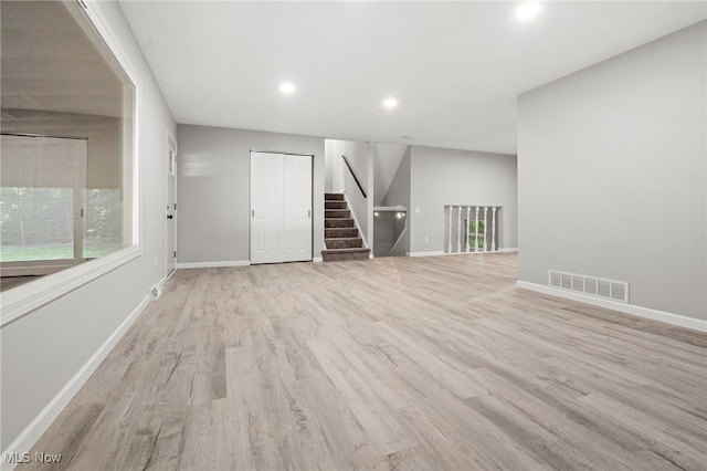 4232 Wilson Rd, Ravenna, OH 44266 - unfurnished room featuring wood finished floors, stairs, and recessed lighting