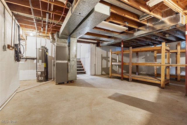 4232 Wilson Rd, Ravenna, OH 44266 - unfinished basement with gas water heater, heating unit, and stairway