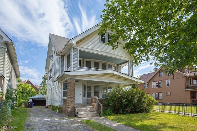 11515 Hopkins Ave, Cleveland, OH 44108 - view of front of house featuring covered porch and an outbuilding