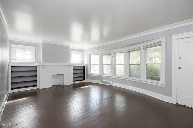 11515 Hopkins Ave, Cleveland, OH 44108 - unfurnished living room featuring crown molding, plenty of natural light, hardwood / wood-style floors, and a fireplace