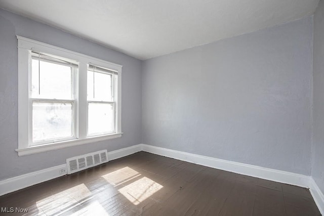 11515 Hopkins Ave, Cleveland, OH 44108 - unfurnished room featuring baseboards and dark wood-style floors