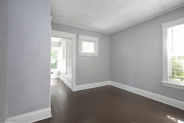 11515 Hopkins Ave, Cleveland, OH 44108 - unfurnished room with dark wood-type flooring and baseboards