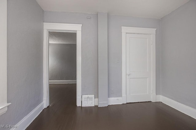 11515 Hopkins Ave, Cleveland, OH 44108 - unfurnished bedroom with wood finished floors and baseboards
