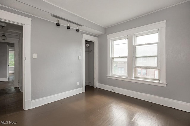 11515 Hopkins Ave, Cleveland, OH 44108 - unfurnished room featuring ornamental molding and dark wood-style floors